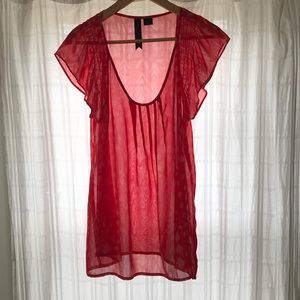 Sheer red blouse with light pink pattern